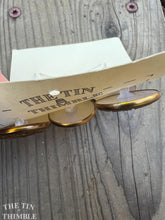 Load image into Gallery viewer, Vintage Plastic and Gold Buttons - Card of Eight - 25mm