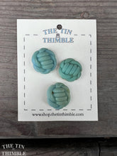 Load image into Gallery viewer, Authentic Vintage Blue Knot Buttons - Three / 1940s Blue Plastic Knot Buttons / Vintage Sewing Notions / Vintage Sewing
