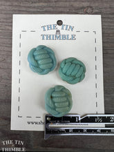 Load image into Gallery viewer, Authentic Vintage Blue Knot Buttons - Three / 1940s Blue Plastic Knot Buttons / Vintage Sewing Notions / Vintage Sewing
